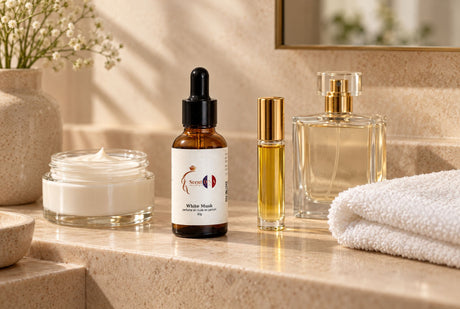 Scent DNA White Musk perfume oil beside unscented body cream, a roll-on bottle and a perfume spray on a bathroom shelf