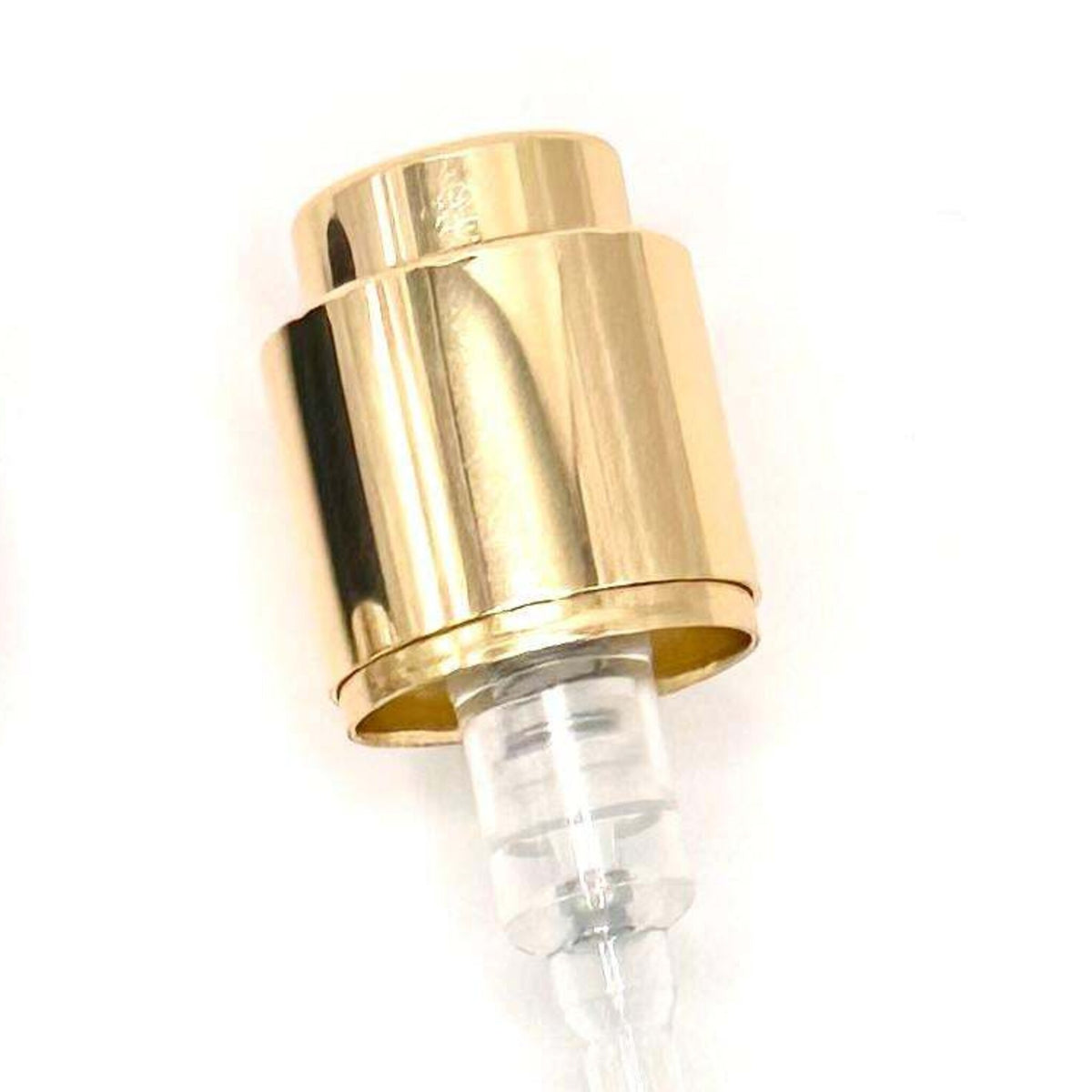 Close-up of the gold collar and actuator of the 15mm Coster crimp-on perfume pump