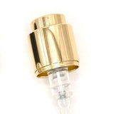 Close-up of the gold collar and actuator of the 15mm Coster crimp-on perfume pump